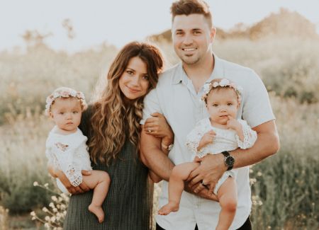Kyler Fisher with his wife and children
